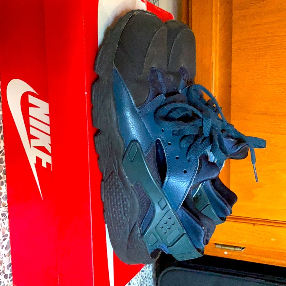 blue and black Nike Huaraches